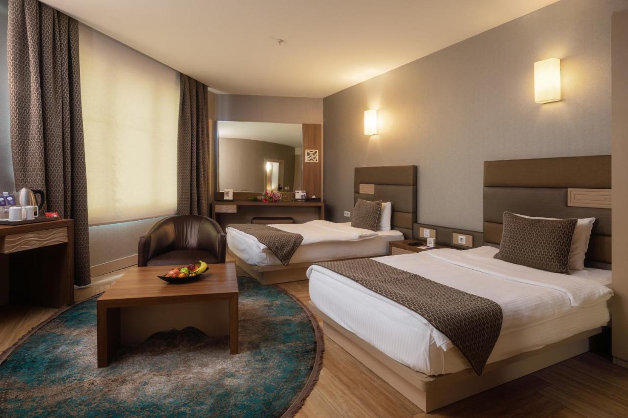 Titanic Hotel & Spa Sulaymaniyah Exterior foto A room at the hotel